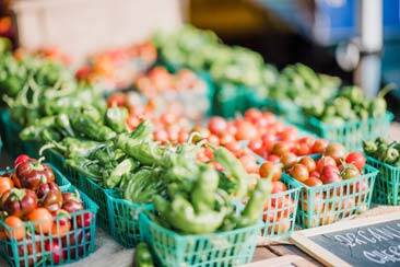 Various fruits and vegetables in baskets in shop counters - AAAF