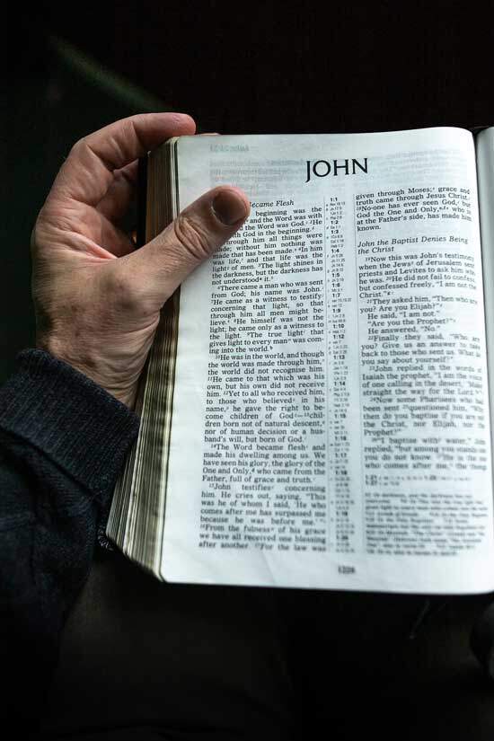 A Bible open to John 1, which discusses the way that Jesus is one with God