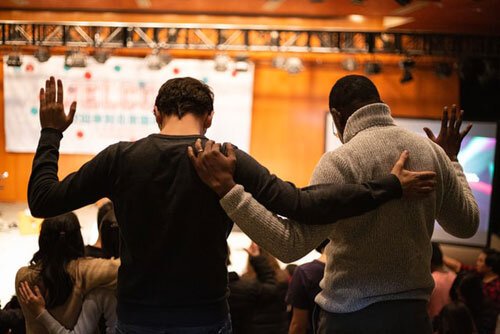 Two students in the religious activities that are part of the daily schedule and school calendar in Adventist Education system