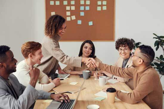 A group of church leaders at a table, exercising the gift of administration