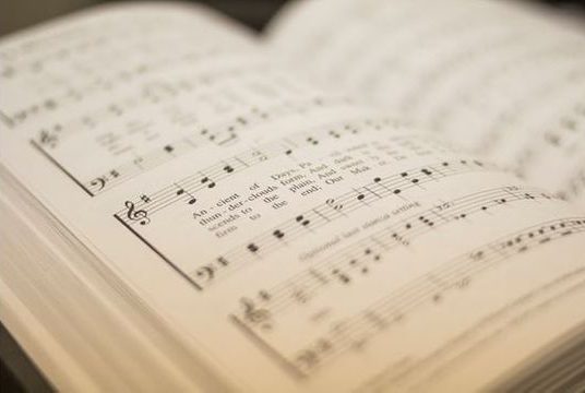 A Seventh-day Adventist hymnal open to a song