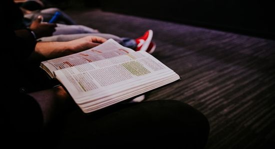 People in small group Bible study and discussion as we learn how the Sabbath School is a time for connection and sharing.