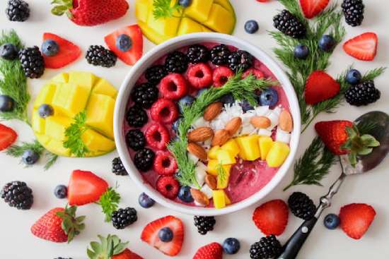 A bowl of colorful fruit, part of a healthy lifestyle