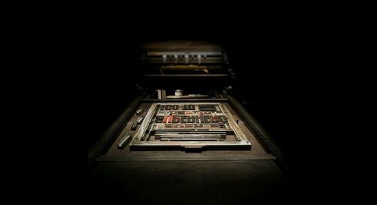 A typeset of a printing press, similar to what early hymnals would've been printed on