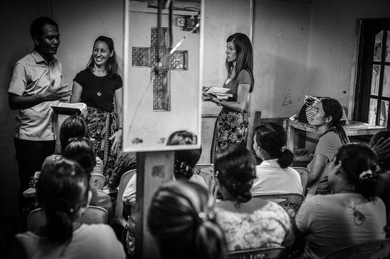 People in small group Bible study and discussion as we learn how the Sabbath School is a time for connection and sharing.