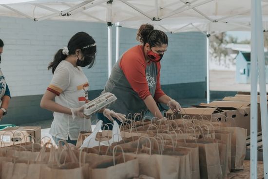 Volunteers packing food parcels as we learn how the Sabbath School group reach out to their community in voluntary service.