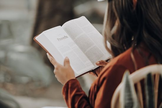 Woman reading Proverbs Woman reading Proverbs as we learn how Sabbath School lesson study guides focus either on a Book of the Bible or on a Topic.