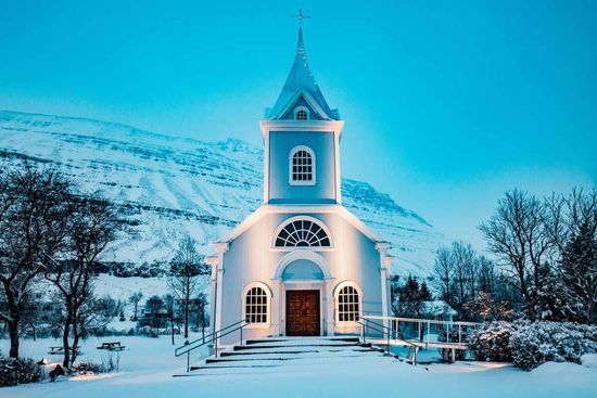 A Seventh-day Adventist Church with a cross above the steeple