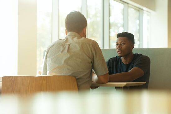 An Adventist pastor counseling a church member