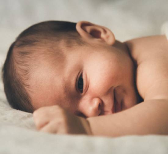 Newborn baby boy A baby lying on a soft blanket
