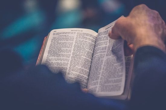 Man studying Bible as we learn how the waiting Adventists continued to search Scriptures to find why Jesus had not returned