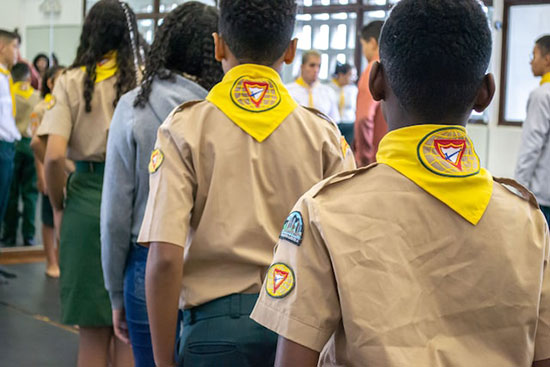 A group of Pathfinders lined up in their uniforms