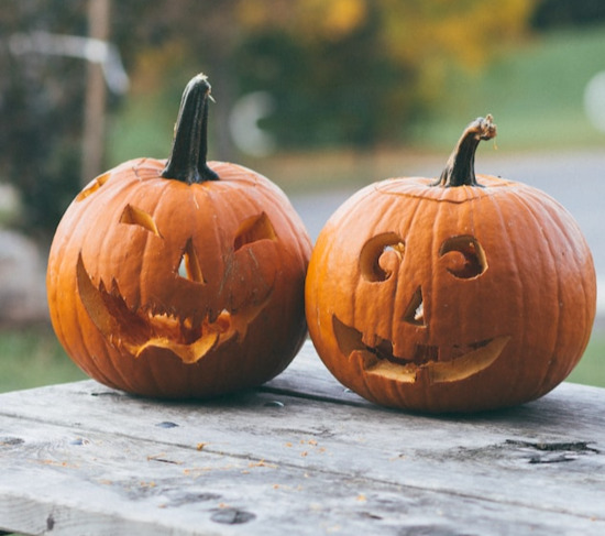 Two pumpkins carved into jack-o-lanterns for Halloween, a holiday that many Adventists don't celebrate