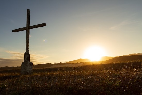 A cross in the sunset, symbolizing Christ and how His death and resurrection are central to Adventism