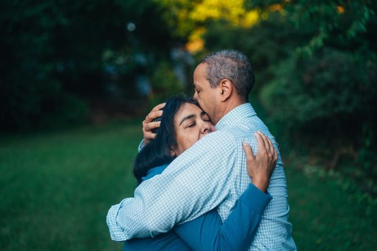 Married couple hugging