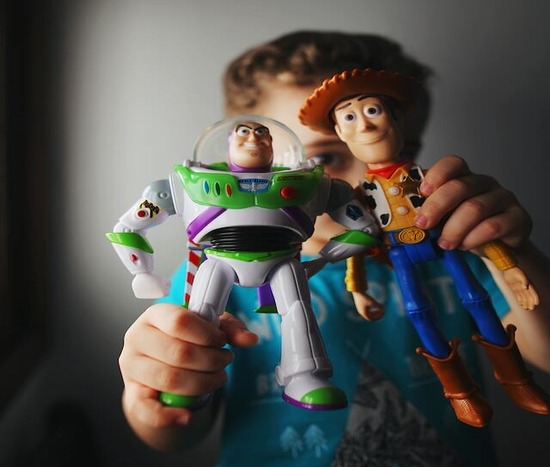 Action Figures A girl holding up action figures she asked for