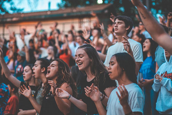 A group of Seventh-day Adventists singing and worshipping God