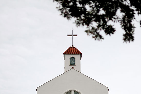 A Seventh-day Adventist Church with a cross above the steeple