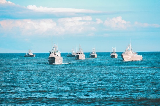 Navy ships on the ocean, reminding us of war, one of the signs of the last days 