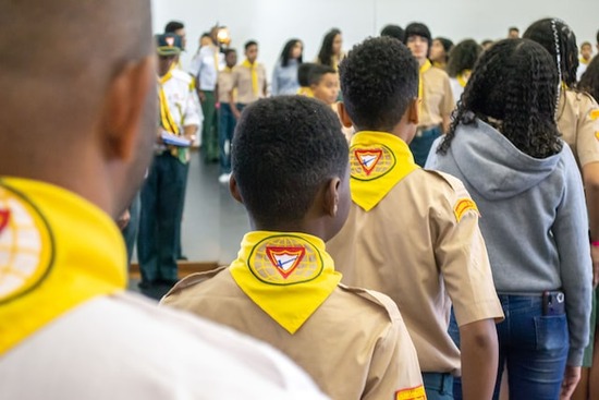 A group of young people lined up at a Pathfinder club meeting