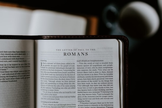 The Bible open to the book of Romans