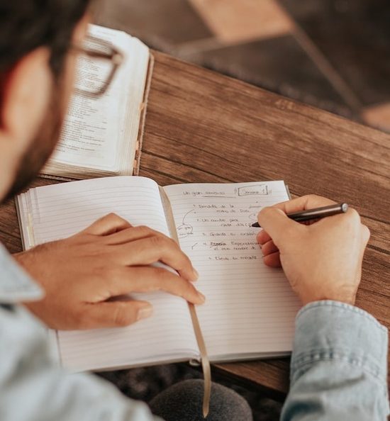 Man taking notes A man taking notes from observations he's made in God's Word
