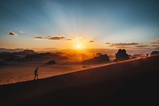 A person climbing a hill, symbolizing victory over sin