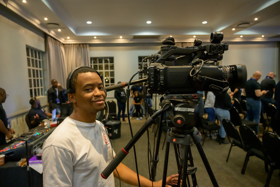 An Adventist camera operator at an evangelistic series