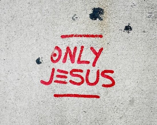 A sign that says in red letters, Only Jesus