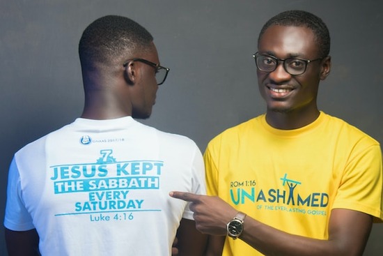 Two men wearing shirts that speak about the Sabbath
