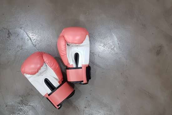 Boxing gloves, representing retaliation