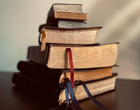 A stack of Bibles on a table