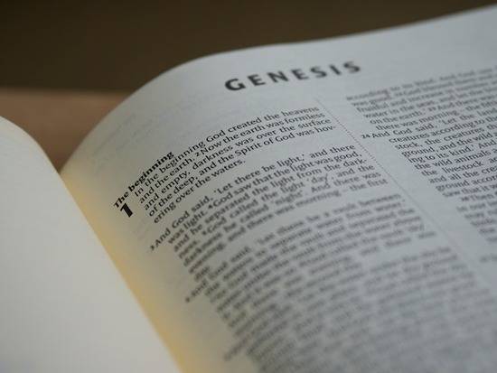 A Bible open to the first book of the Old Testament, Genesis