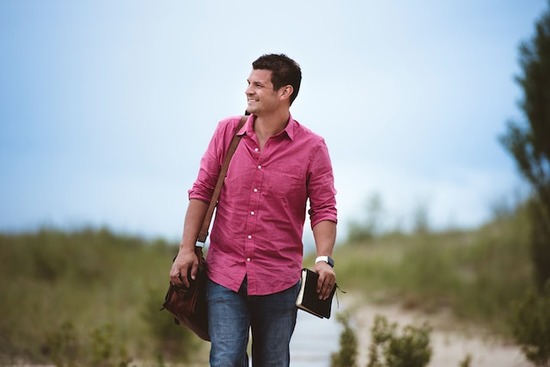  A man walking with a Bible in his hand