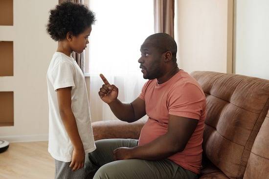 A father giving instructions to a child