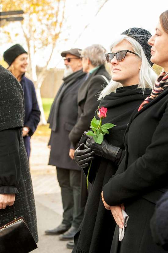 People gathered for a funeral and burial service