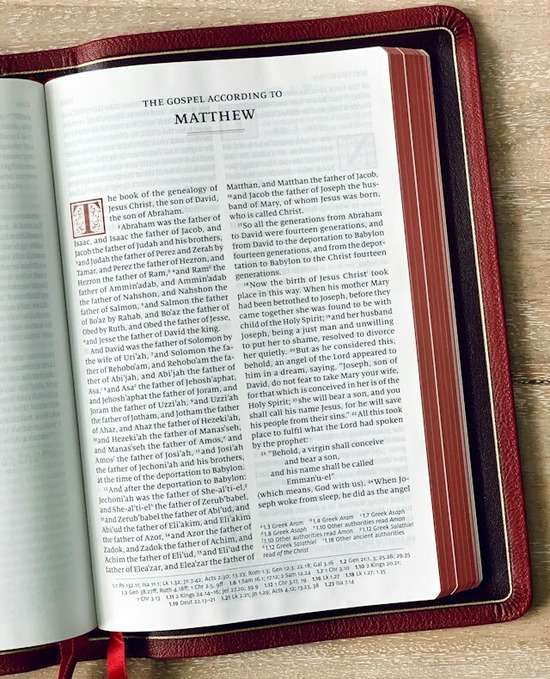 A Bible open to the first page of the Gospel of Matthew