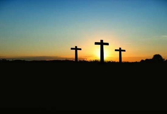 Three crosses in the sunset
