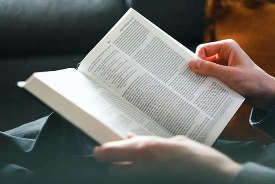 A person with the Bible open to the book of Matthew