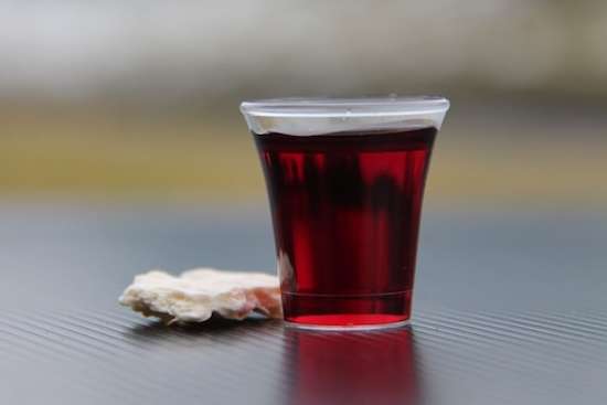 A cracker and grape juice for a Communion service
