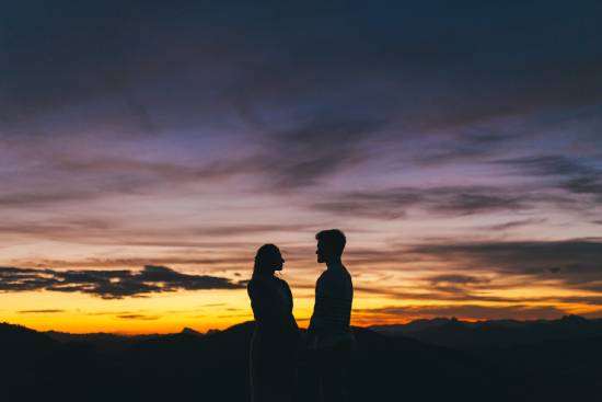 Couple holding hands A couple holding hands in the sunset, reminding us that God made man and woman to reflect the glory of God